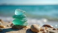 Stack of stones on sandy beach with ocean background in soft focus. Neat arrangement of six stones varying in size, shape. Calm Royalty Free Stock Photo