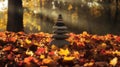 Stack of Balanced Stones on Colorful Fall Leaves in a Park Setting Royalty Free Stock Photo