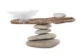 Stack of stones with tree branch and feather on white background. Balance concept Royalty Free Stock Photo