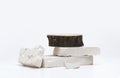 Stack stones and wood disk stump platform podium on gray light copy spase background. Minimal empty display product presentation