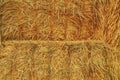 A stack of straw bales background. Close-up. Agricultural concept