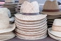 Pile of mediterranean straw summer hats on a market. Royalty Free Stock Photo