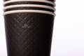 Stack of stylish black paper cups on isolated white background. Mug of 300 ml Royalty Free Stock Photo