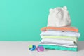 Stack of stylish child clothes and pacifiers Royalty Free Stock Photo