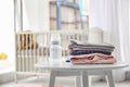 Stack of stylish child clothes on table Royalty Free Stock Photo