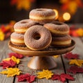 A stack of sugar-coated donuts is displayed on a wooden cake stand. Royalty Free Stock Photo
