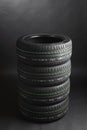 Stack of summer tires, gray background