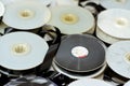 Stack of supply and take up reels with ribbon of VHS video cassette tapes used on old video players and recorders, retro style Royalty Free Stock Photo