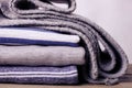 Stack of sweatshirts and a scarf