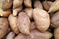 Stack of sweet potatoes on a market stall Royalty Free Stock Photo