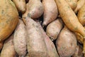 Stack of sweet potatoes on a market stall Royalty Free Stock Photo