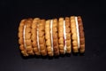 Stack of sweetmeal digestive biscuits isolated on black background