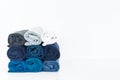 Stack of t-shirt rolled up on white background Royalty Free Stock Photo