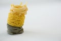 Stack of tagliatelle and capellini pasta Royalty Free Stock Photo