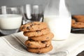 Stack of tasty chocolate chip cookies and milk Royalty Free Stock Photo