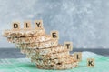 Stack of tasty crispbread with wooden letters on blue background