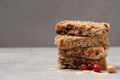 Stack of tasty granola bars on light grey table, closeup. Space for text Royalty Free Stock Photo