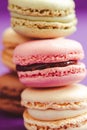 Stack of tasty macarons including vanilla, chocolate and strawberry flavours. Royalty Free Stock Photo