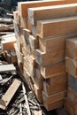 Stack of teak wood square in lumber yard. pile Wooden