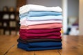 stack of team company t-shirts neatly folded