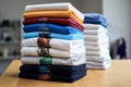 stack of team company t-shirts neatly folded