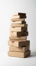 A stack of ten cardboard boxes of varying sizes is arranged on top of each other Royalty Free Stock Photo