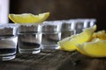 Stack of tequila with salt and lemon on a wooden background Royalty Free Stock Photo