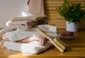 Stack of terry bath towels in different brown shades and washing accessories Royalty Free Stock Photo