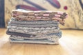 Stack of textile sheets blankets on a wooden shelf f Royalty Free Stock Photo