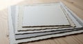 Stack of textured handmade paper sheets with deckled edges textured paper art paper Royalty Free Stock Photo