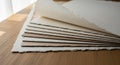 Stack of textured handmade paper sheets in various natural colors image photo Royalty Free Stock Photo