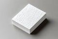 Stack of textured white square cards on gray background Royalty Free Stock Photo
