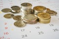 Stack of Thai coins on calendar, closeup shot, for finance background