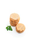 Stack of thin round crispbreads with herbs isolated on white Royalty Free Stock Photo