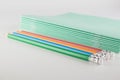 Stack of thin student notebooks with colored pencils Royalty Free Stock Photo