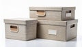 Stack of Three Beige Woven Textured Boxes with Lids on White Background Royalty Free Stock Photo