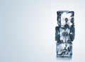 Stack of three blue ice cubes with copyspace Royalty Free Stock Photo