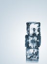 Stack of three blue ice cubes with copyspace Royalty Free Stock Photo