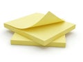 A stack of three bright yellow sticky notes on a white background Royalty Free Stock Photo
