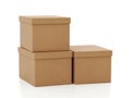Stack of three brown cardboard boxes isolated on white background Royalty Free Stock Photo