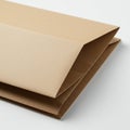 A stack of three brown kraft paper envelopes is displayed, one on top of the other. The Royalty Free Stock Photo