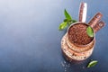 Stack of three copper measuring cups with mixed raw quinoa Royalty Free Stock Photo