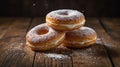Delicious Stack of Cream Filled Donuts Sprinkled with Powdered Sugar on a Wooden Surface Royalty Free Stock Photo