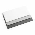 Stack of three folded paper sheets in different shades of grey and white Royalty Free Stock Photo