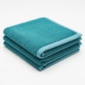 Stack of three folded teal kitchen towels on white background isolated on white background Royalty Free Stock Photo