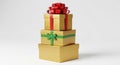 Stack of Three Gold Gift Boxes Decorated with Red and Green Ribbons Royalty Free Stock Photo