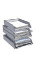 A stack of three gray, rectangular trays filled with sheets of paper is Royalty Free Stock Photo