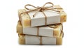 Stack of three handmade natural soap bars wrapped in white paper and twine isolated on white background Royalty Free Stock Photo