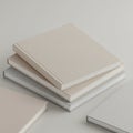A stack of three hardback books with blank, textured covers in neutral tonesâbeige Royalty Free Stock Photo