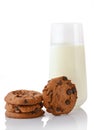 Stack of three homemade chocolate chip cookies, single cookie and glass of milk Royalty Free Stock Photo